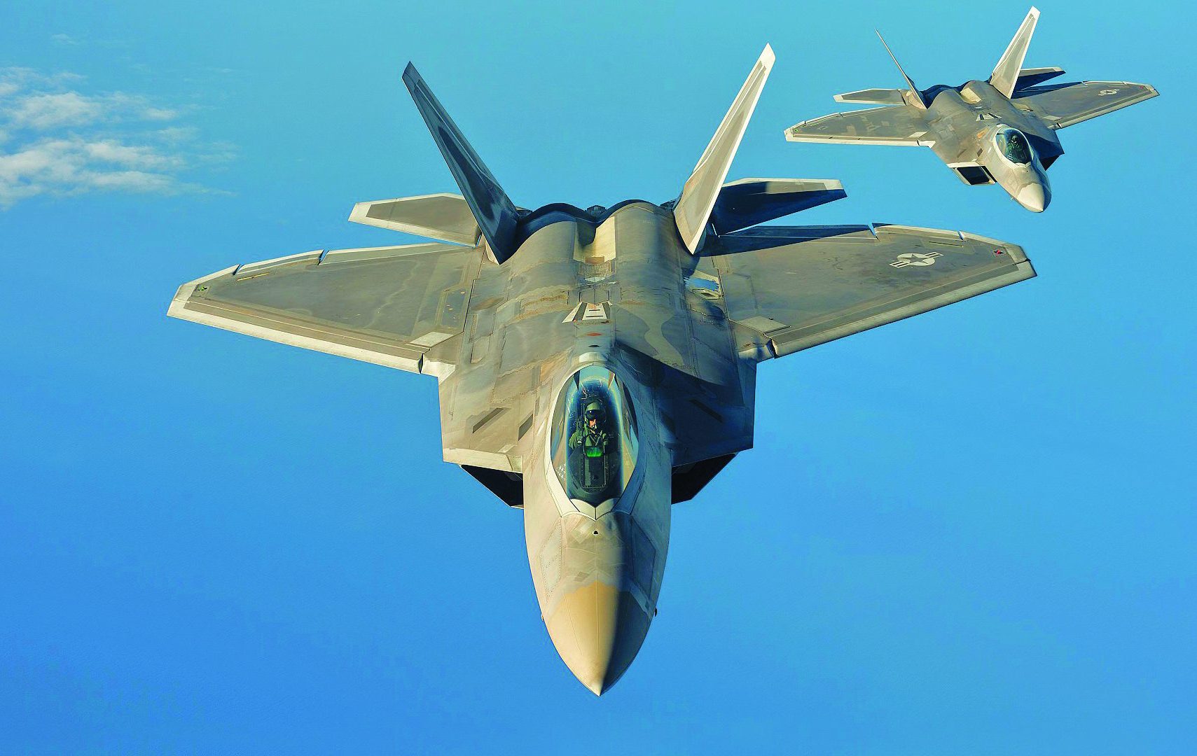 Two U.S. Air Force F-22 Raptors from the 95th Fighter Squadron, Tyndall Air Force Base, Fla., fly over the Baltic Sea, Sept. 4, 2015. The U.S. Air Force has deployed four F-22 Raptors, one C-17 Globemaster III, approximately 60 Airmen and associated equipment to Spangdahlem Air Base, Germany. While these aircraft and Airmen are in Europe, they will conduct air training with other Europe-based aircraft. (U.S. Air Force photo by Tech. Sgt. Jason Robertson/Released)