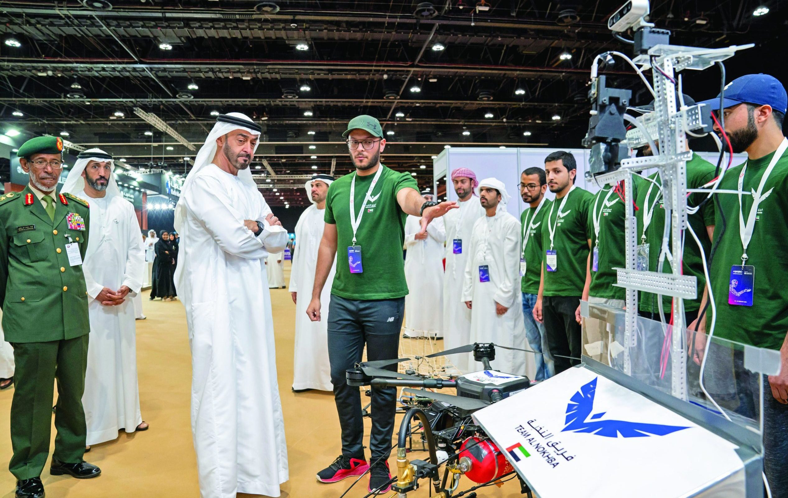 ABU DHABI, UNITED ARAB EMIRATES - February 24, 2020: HH Sheikh Mohamed bin Zayed Al Nahyan, Crown Prince of Abu Dhabi and Deputy Supreme Commander of the UAE Armed Forces (3rd L) visits Team Al Nokhba, while touring the Fourth Edition of The Unmanned System Exhibition and Conference (UMEX) 2020, at ADNEC. Seen with HE Lt General Hamad Thani Al Romaithi, Chief of Staff UAE Armed Forces (L) and HE Mohamed Mubarak Al Mazrouei, Undersecretary of the Crown Prince Court of Abu Dhabi (2nd L).

( Mohamed Al Hammadi / Ministry of Presidential Affairs )
---