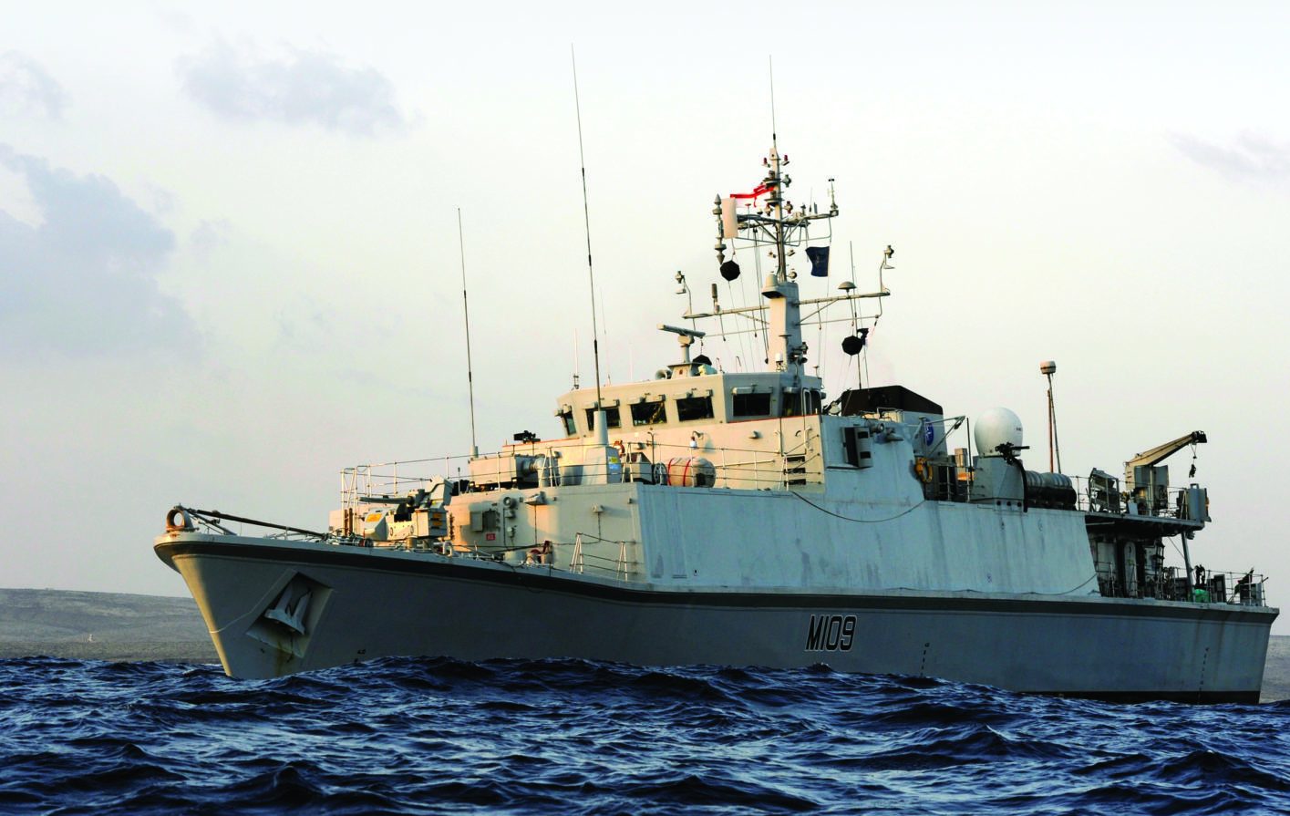 Sandown Class Mine Countermeasures Vessel HMS Bangor is pictured near Tobruk, Libya. 

HMS Bangor and HMNS Vlaardigen had been given the task of clearing a shipping lane into the Key Port of Tobruk, Libya. Once this task had been completed HMS Bangors divers seized the opportunity to hone their skills in the shallow waters off the Libyan coast.

HMS Bangor is the ninth of the Sandown class of minehunters and was built by Vosper Thorneycroft UK Ltd at Woolston, Southampton. She was launched on the 16th April 1999 by Lady Lisa Spencer.

HMS Bangor is the first ship to be closely affiliated to Northern Ireland for over 15 years and has other official affiliations with the town of Bangor, Bangor Combined Cadet Force and Bangor Grammar School. The crew are very proud of her battle honours from Dieppe in 1942, Normandy and the English Channel in 1944 and most recently Al Faw in 2003.
