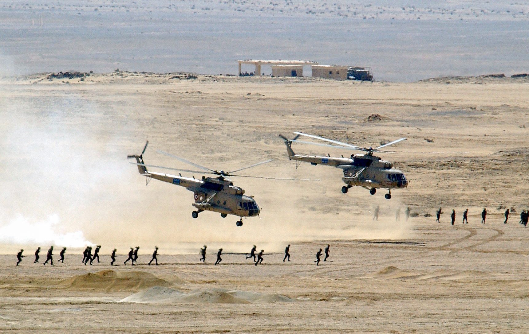 Two Soviet-made Egyptian Mi-8 Hip helicopters lift off after dropping of Egyptian Army Soldiers, at Mubarak Military City, as US, Spanish and Egyptian armed forces conduct amphibious assault operations during Exercise BRIGHT STAR 01/02. BRIGHT STAR 01/02 is a multinational exercise involving more than 74,000 troops from 44 countries that enhances regional stability and military-to-military cooperation among our key allies, and our regional partners. It prepares US Central Command to rapidly deploy and employ the forces needed to deter aggressors and, if necessary, fight and win side-by-side with our allies and regional partners.