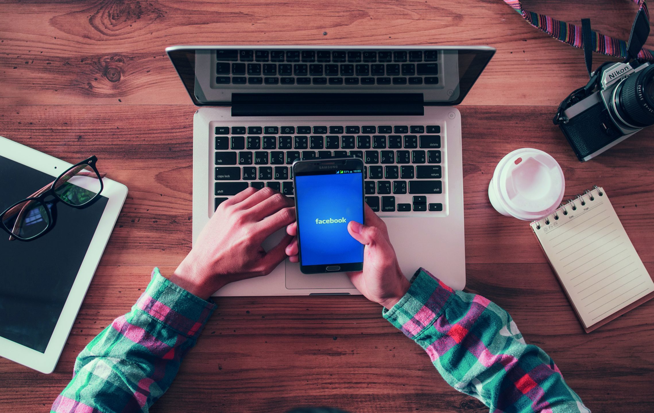 BANGKOK, THAILAND - February 3, 2018: man holds Phone with facebook application on the screen.facebook is a photo-sharing app for smartphones.