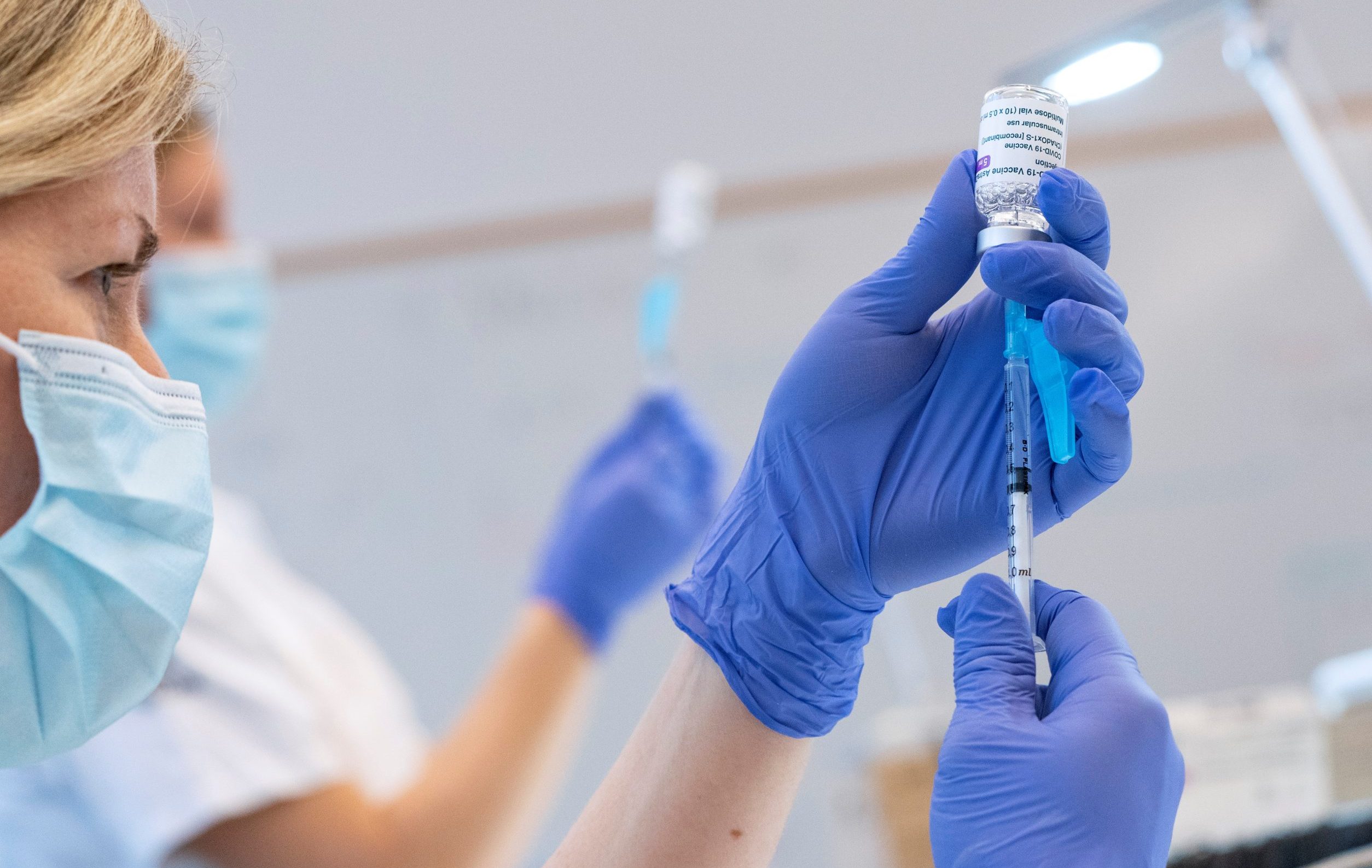 Syringes are filled with the AstraZeneca COVID-19 vaccine at the Skane University Hospital vaccination centre in Malmo