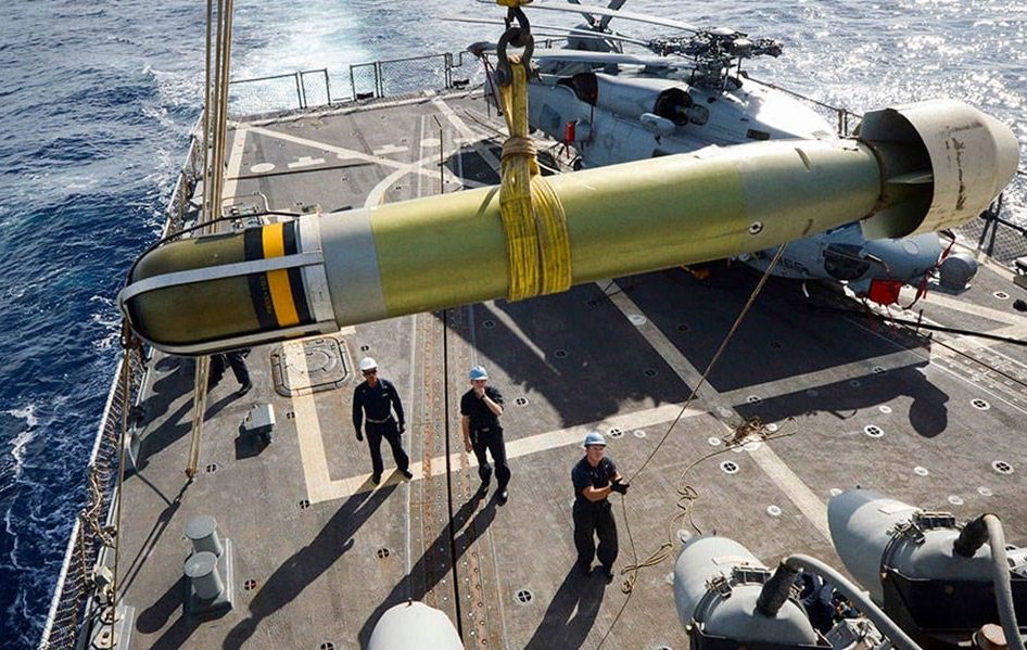 Sailors-aboard-the-USS-Winston-S-Churchill-maneuver-a-Mark-54-torpedo-to-the-flight-deck