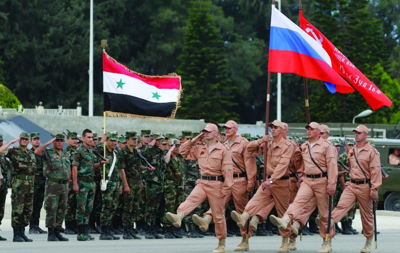 epa05290100 Russian soldiers march during a rehearsal of Victory Day parade, in which they will take part with a Syrian unit at Hmeimym airbase in Latakia province, Syria, 04 May 2016. Victory Day will be held on 09 May 2016 to mark the 71st anniversary since the capitulation of Nazi Germany to the Soviet Union. Hmeimym airbase serves as the base of operation for the Russian air force in Syria. The United States and Russia have agreed to extend the cease-fire in Syria to the city of Aleppo, the US State Department reported on 04 May.  EPA/SERGEI CHIRIKOV
