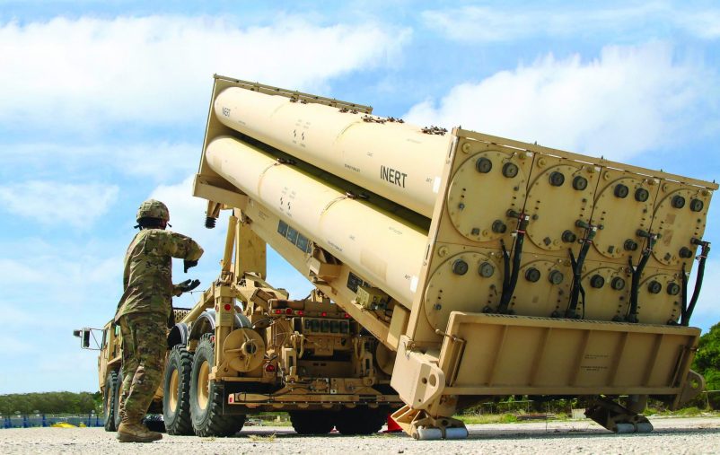 U.S. Army Cpl. Rogelio Argueta, Patriot Launching Station Enhanced Operator-Maintainer, assigned with Task Force Talon, 94th Army Air and Missile Defense Command gives commands, during a practice missile reload and unload drills on a Terminal High Altitude Area Defense (THAAD) system trainer at Andersen Air Force Base, Guam, Feb. 6, 2019. (Army photo by Capt. Adan Cazarez)