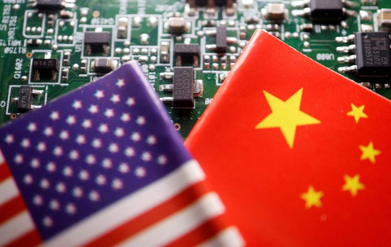 FILE PHOTO: Illustration picture of Chinese and U.S. flags with semiconductor chips